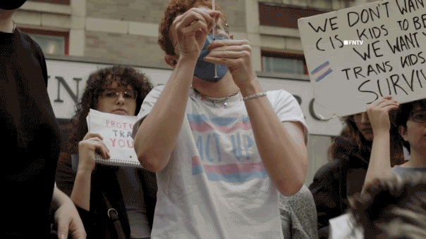 Trans activists inject themselves with hormones in viral stunt protesting Trump's DOJ deal with NYU