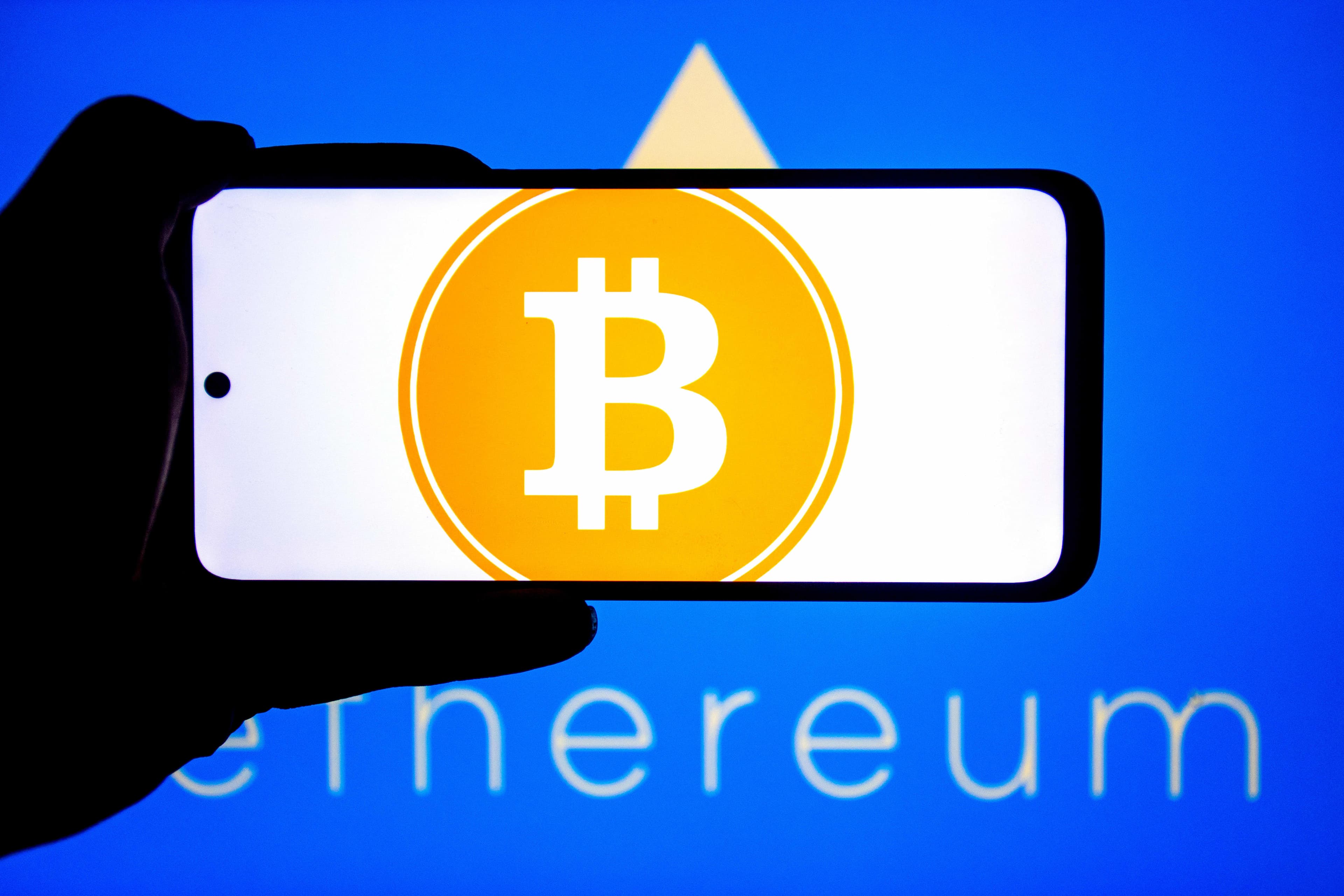 Bitcoin hits highest level since July, boosting other coins and crypto-related stocks