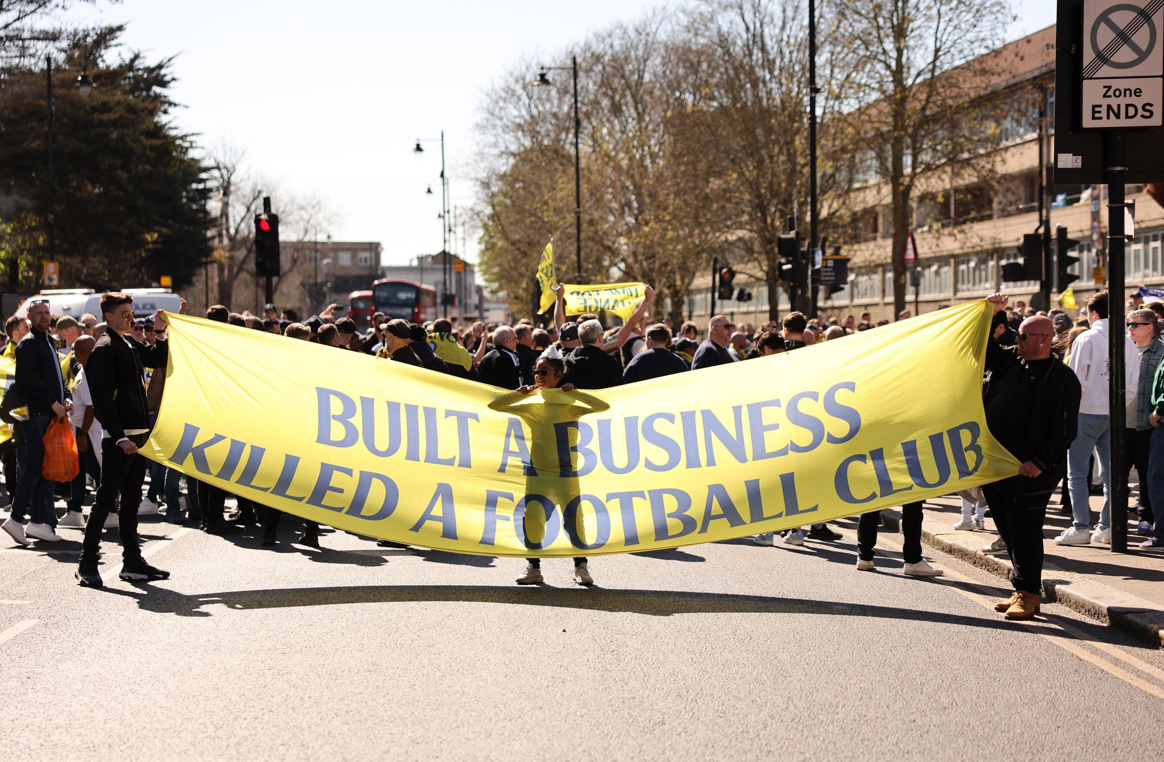 Tottenham fans protest against owners Enic and chairman Daniel Levy